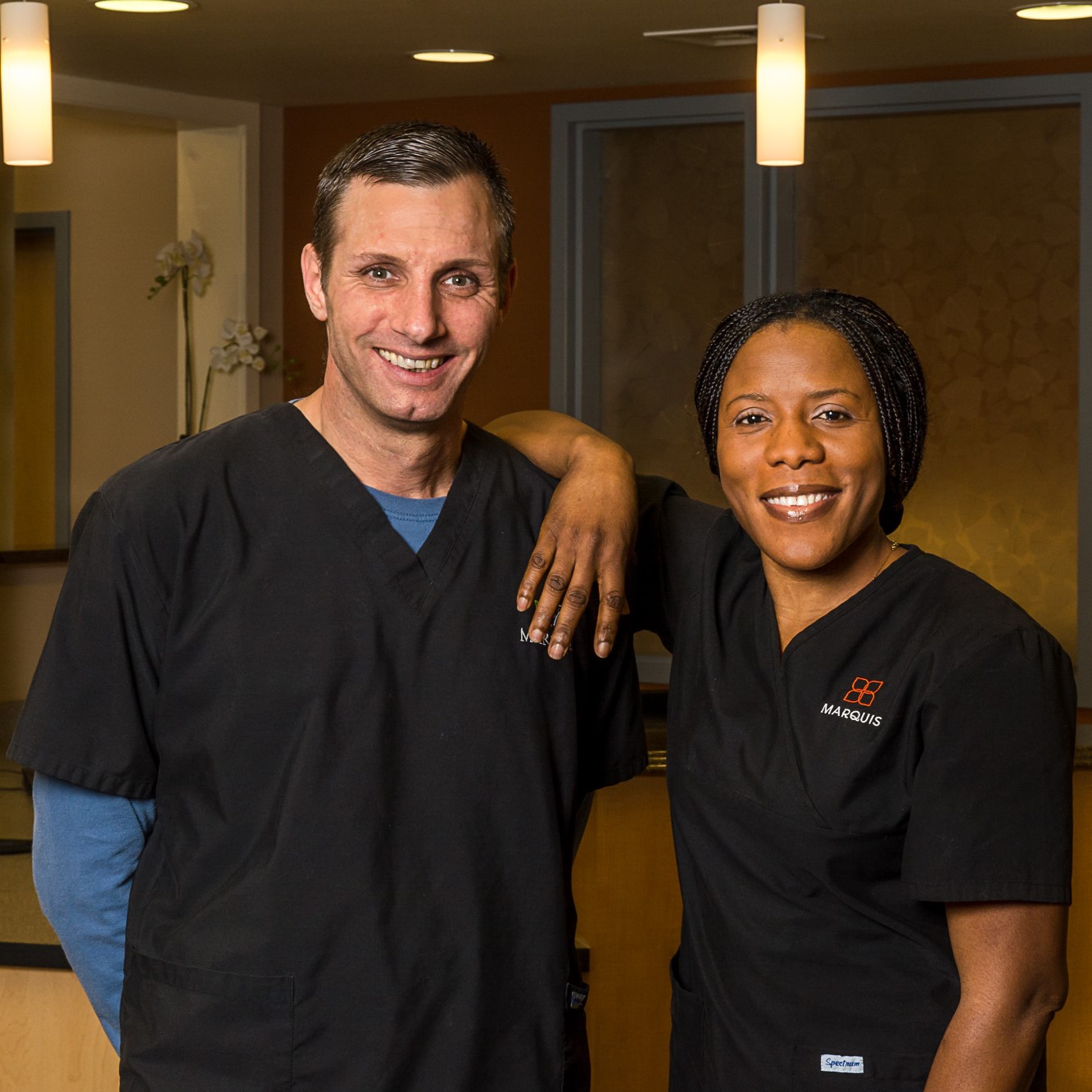 Marquis certified nursing assistants Two Marquis certified nursing assistants standing together and smiling
